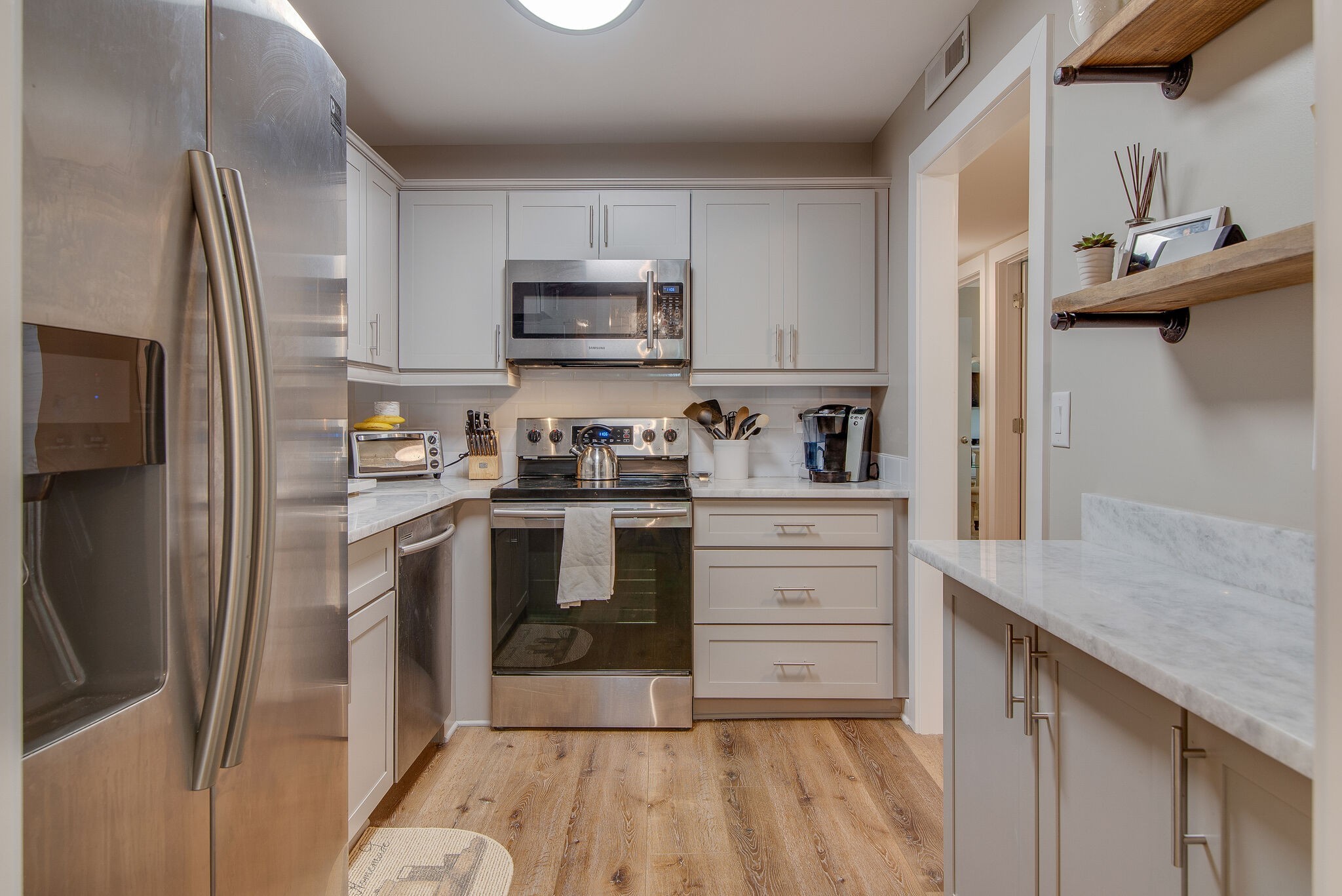 1900 Richard Jones Road, Unit R4 Nashville, TN 37215 - Photo 12 of 32 a kitchen with stainless steel appliances a refrigerator sink and microwave