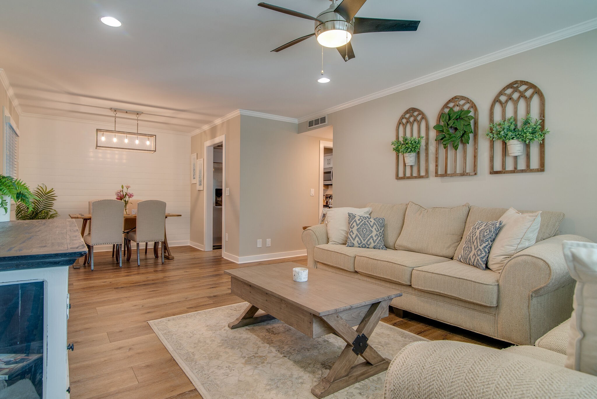1900 Richard Jones Road, Unit R4 Nashville, TN 37215 - Photo 9 of 32 a living room with furniture a table and a chandelier