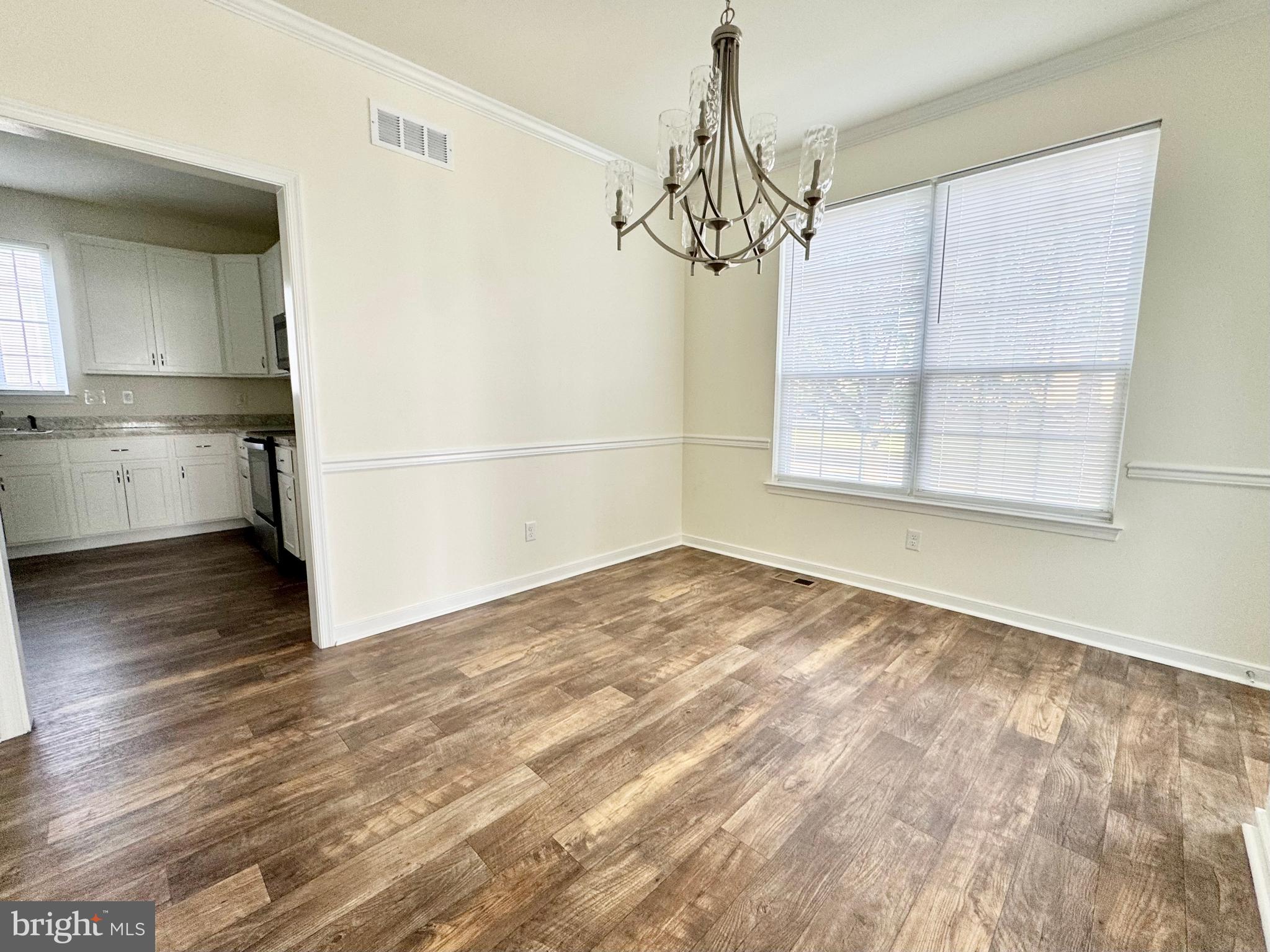 656 Venue Drive Dover, DE 19901 - Photo 11 of 29 a view of empty room with wooden floor and fan