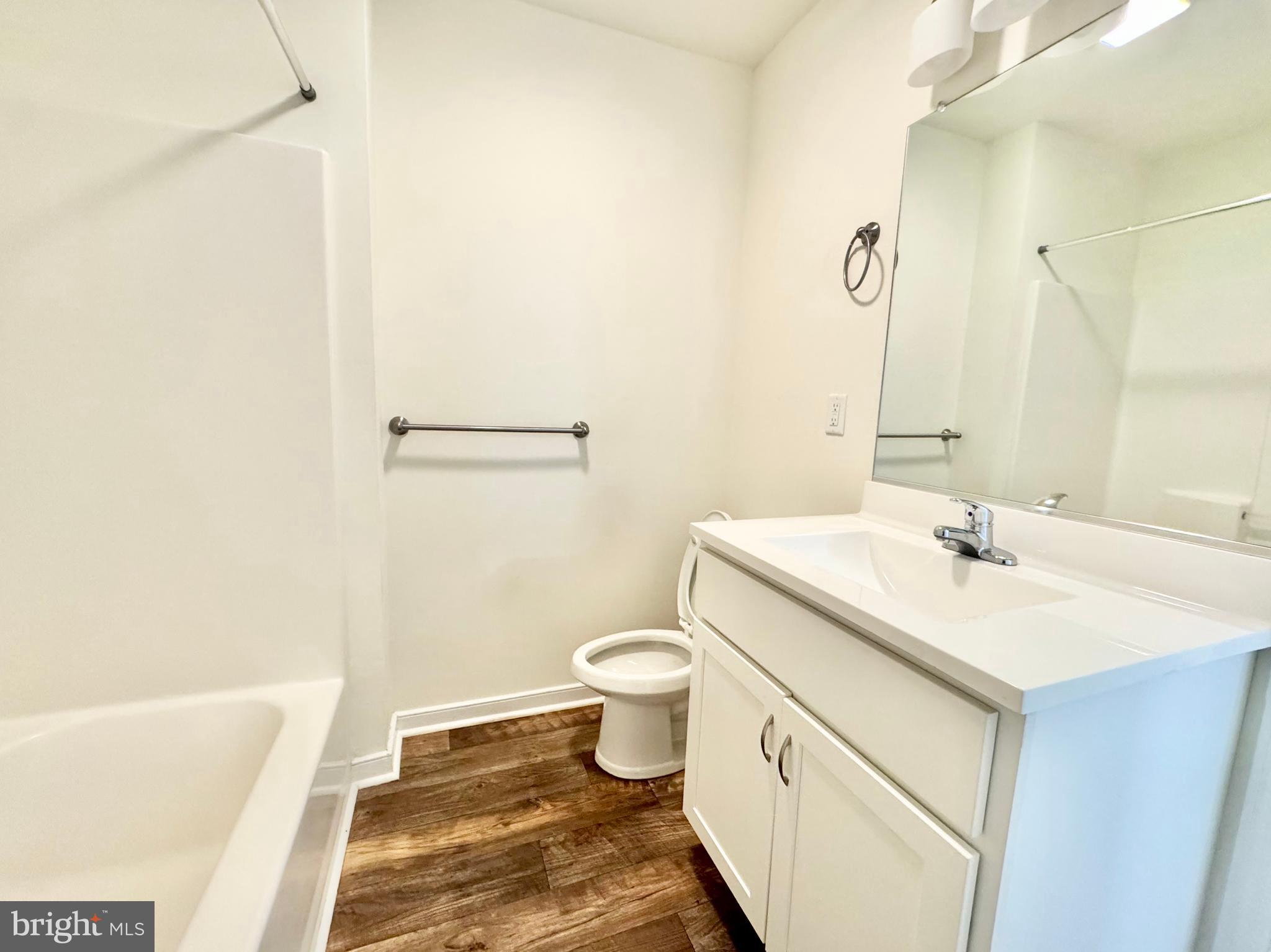 656 Venue Drive Dover, DE 19901 - Photo 24 of 29 a bathroom with a sink a toilet and a bathtub
