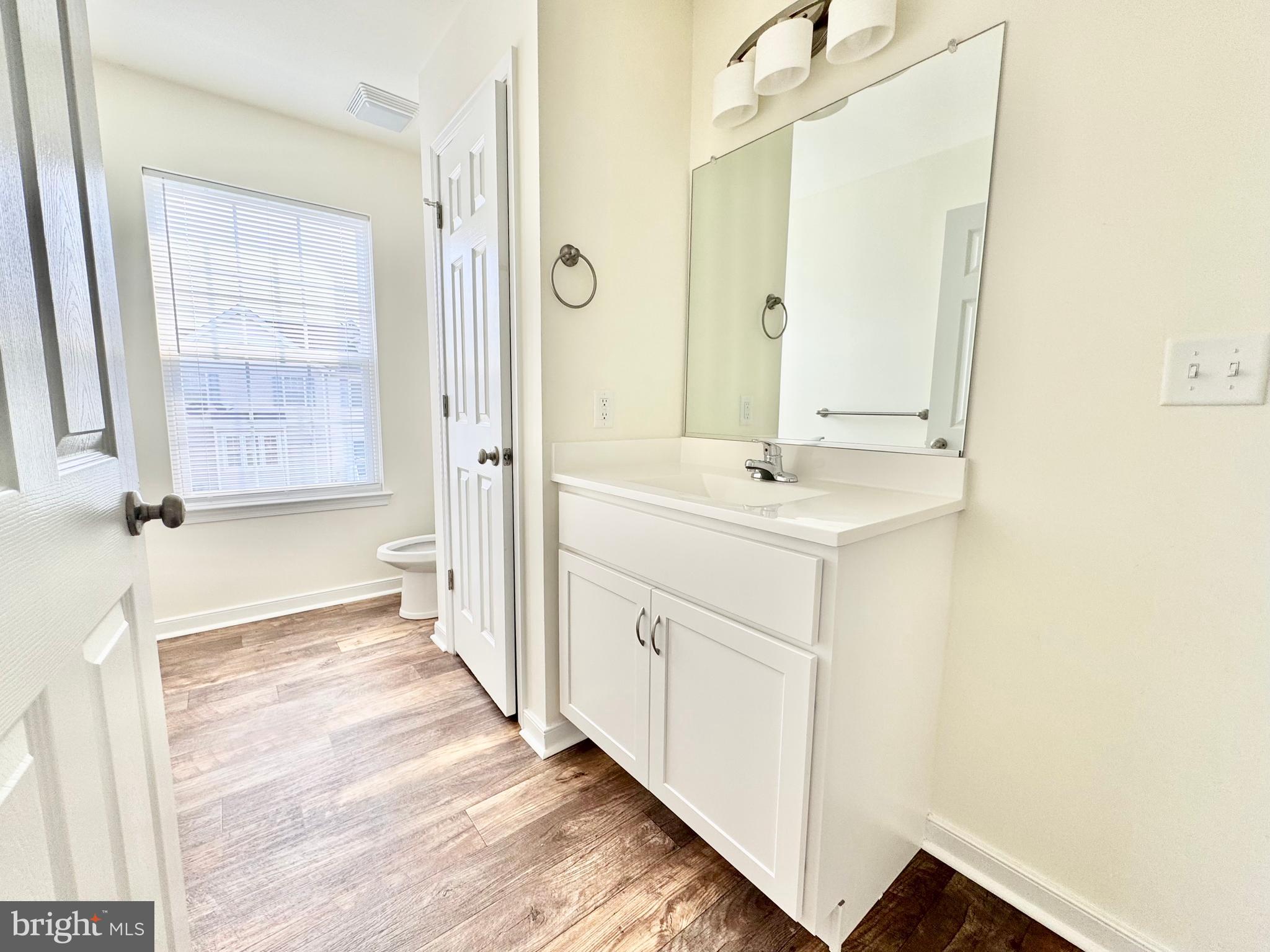 656 Venue Drive Dover, DE 19901 - Photo 28 of 29 a bathroom with a sink a mirror and a shower