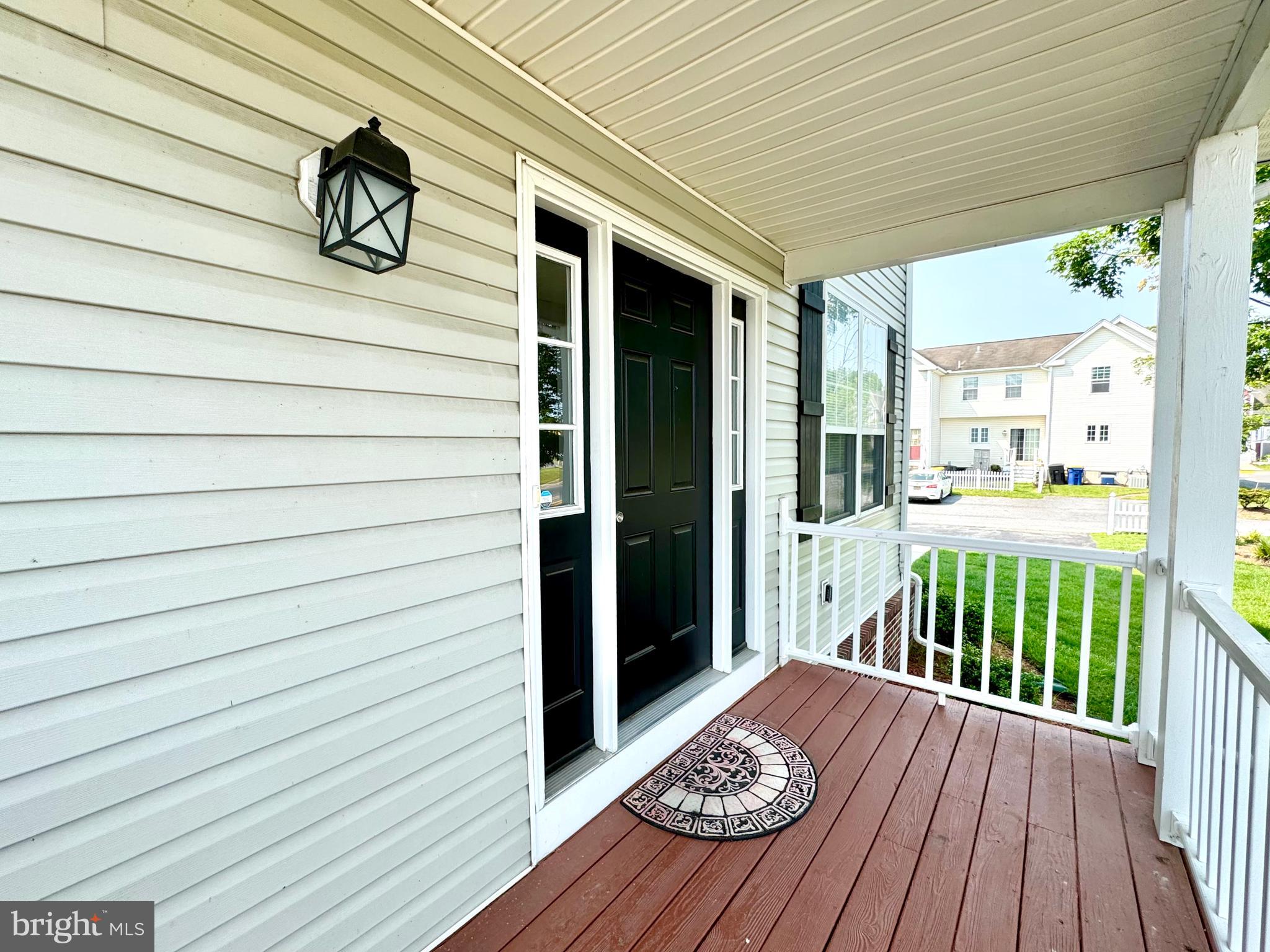 656 Venue Drive Dover, DE 19901 - Photo 3 of 29 a view of a porch with wooden floor