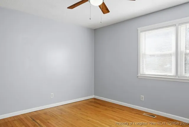 a bathroom with a sink toilet vanity and shower