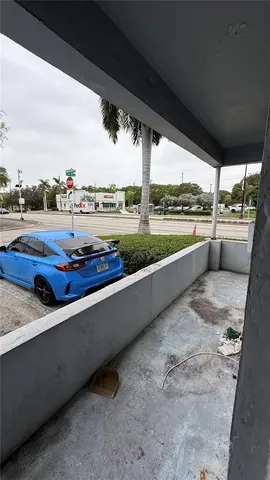a view of balcony with furniture and city view