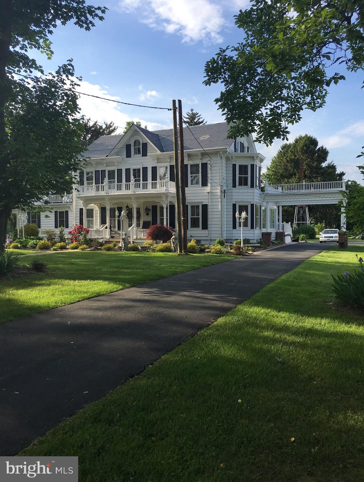 a front view of building with yard and green space