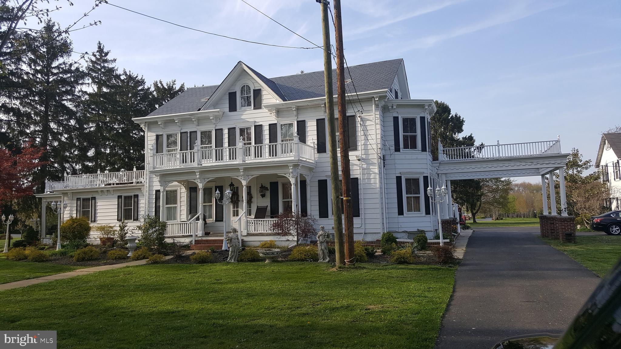 77 Petty Road Cranbury, NJ 08512 - Photo 2 of 32 a front view of house with yard and green space