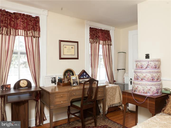 77 Petty Road Cranbury, NJ 08512 - Photo 22 of 32 a view of a workspace with furniture and a window