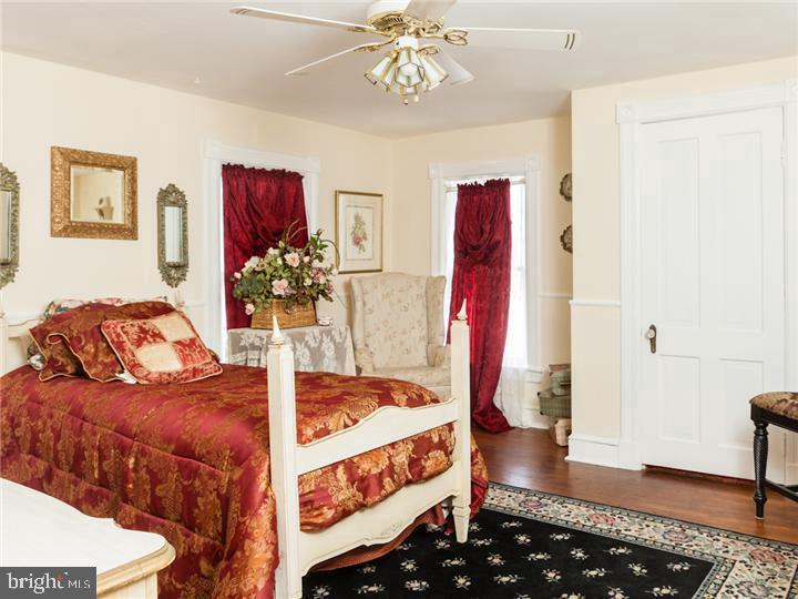 77 Petty Road Cranbury, NJ 08512 - Photo 23 of 32 a bedroom with bed and wooden floor