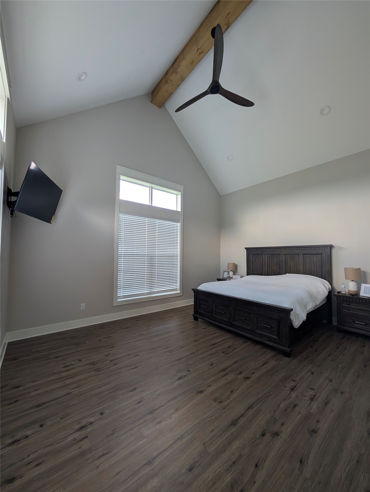 13504 Hudson Farms Road Franklin, TX 77856 - Photo 45 of 49 a spacious bedroom with a bed and wooden floor
