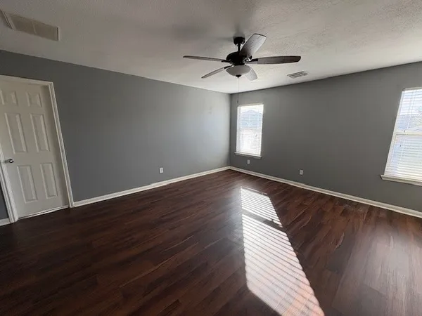 a view of room window and wooden floor