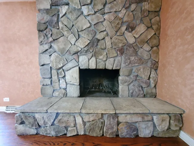 a living room with a couch and a fireplace