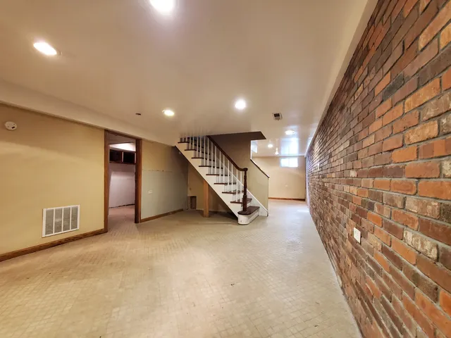 a view of an empty room with a fireplace