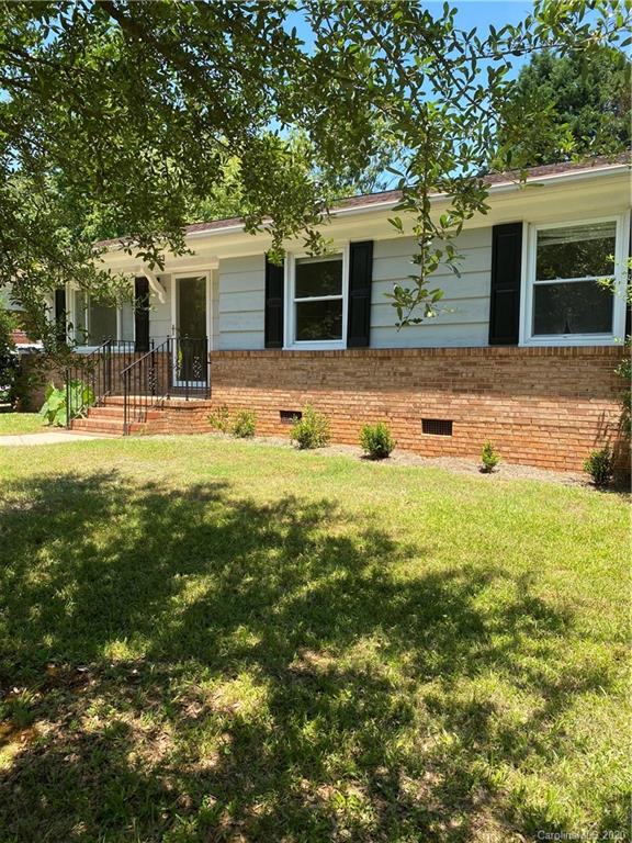 7323 Idlewild Road Charlotte, NC 28212 - Photo 11 of 13 front view of a house with a yard