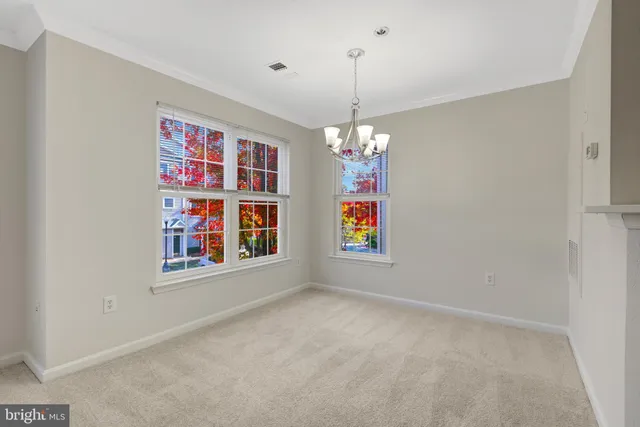a kitchen with stainless steel appliances a refrigerator and a stove top oven