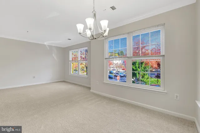 a kitchen with a refrigerator sink and white stove