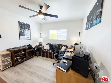 a bed room with furniture and a window