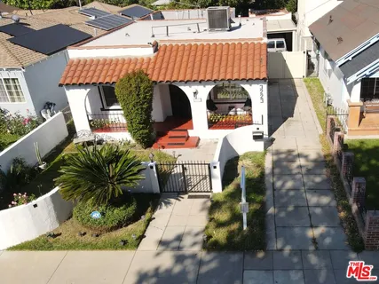 an aerial view of a house with swimming pool