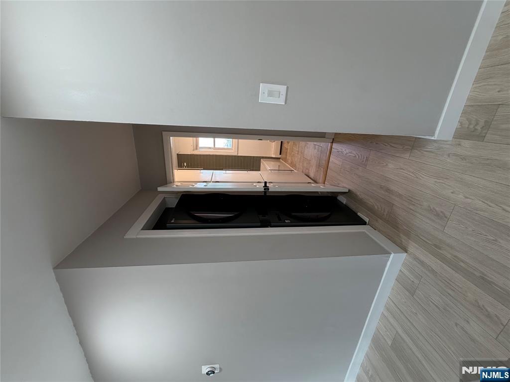 157 Cottage Place, Unit 2 Fairview, NJ 07022 - Photo 12 of 33 a view of hallway with wooden floor
