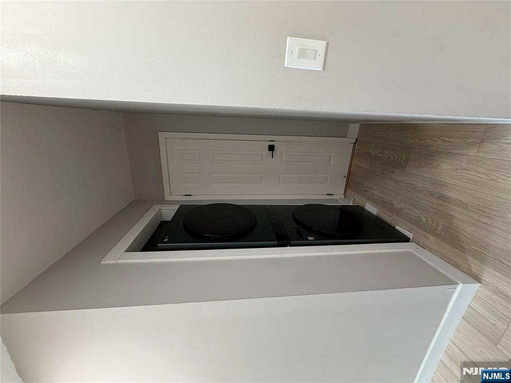 157 Cottage Place, Unit 2 Fairview, NJ 07022 - Photo 13 of 33 a view of walk in closet with clothes