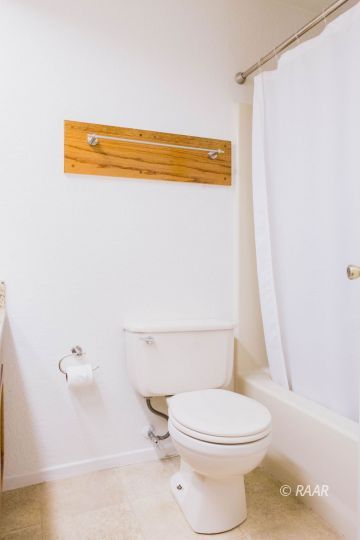 1114 North Inyo Street Ridgecrest, CA 93555 - Photo 25 of 31 a bathroom with a toilet and a shower