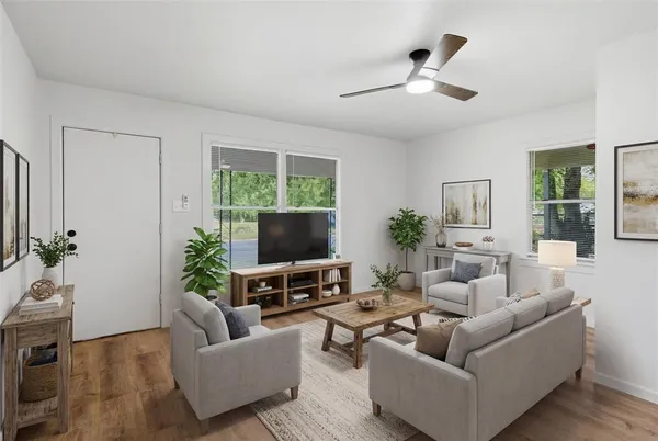 a living room with furniture and a flat screen tv