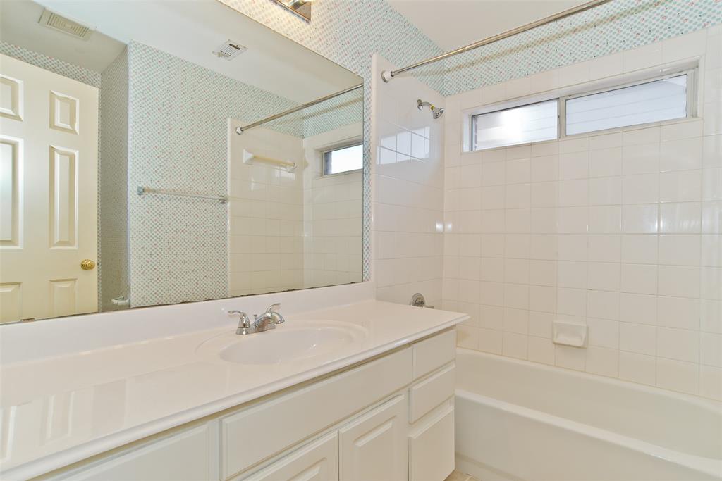 426 Richmond Street Irving, TX 75063 - Photo 15 of 33 a bathroom with a bathtub and a sink