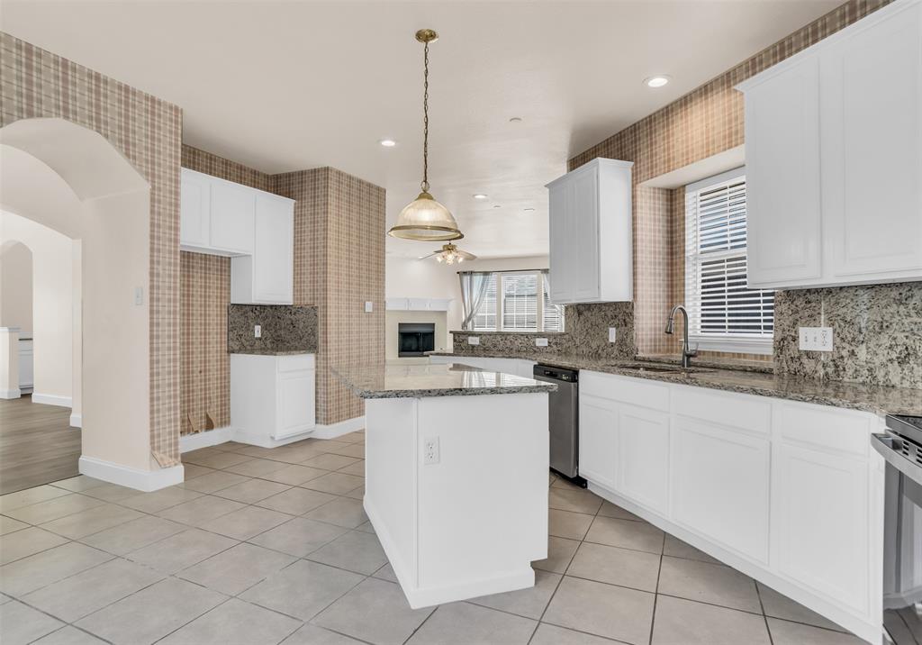 426 Richmond Street Irving, TX 75063 - Photo 18 of 33 a kitchen with stainless steel appliances granite countertop a refrigerator a sink and white cabinets