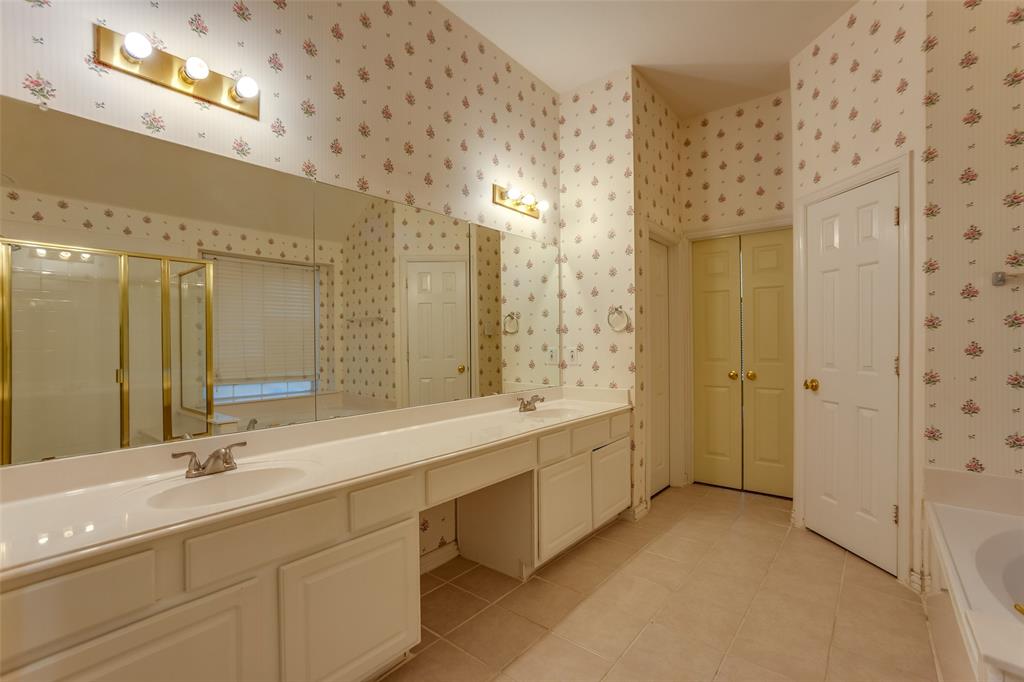 426 Richmond Street Irving, TX 75063 - Photo 25 of 33 a bathroom with a double vanity sink mirror and shower