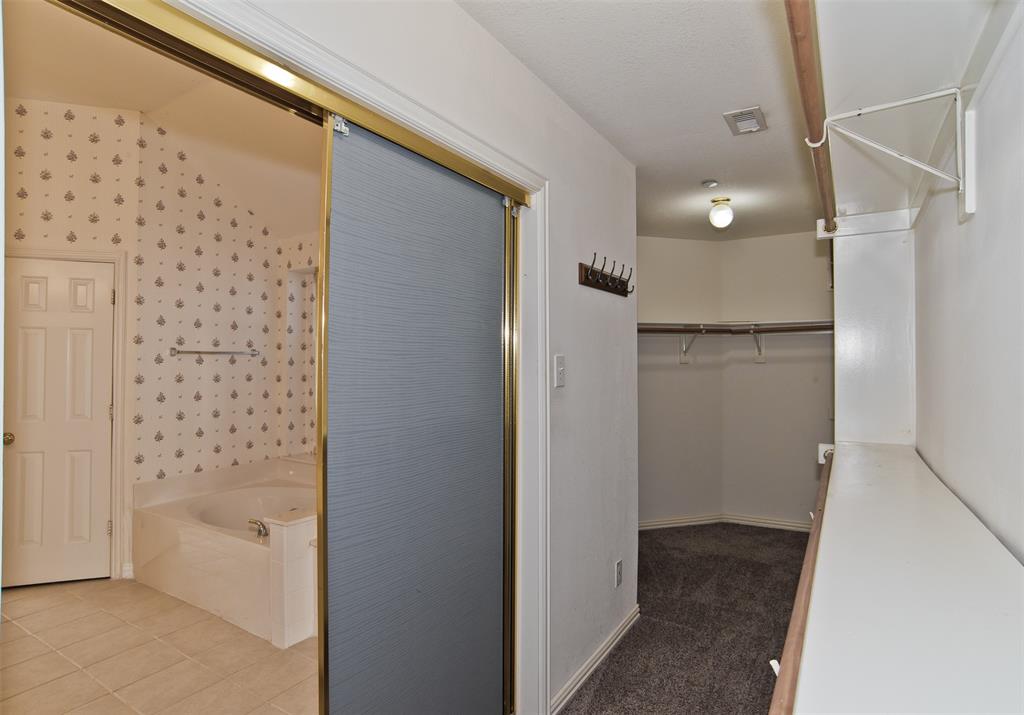 426 Richmond Street Irving, TX 75063 - Photo 26 of 33 a bathroom with a bathtub and shower