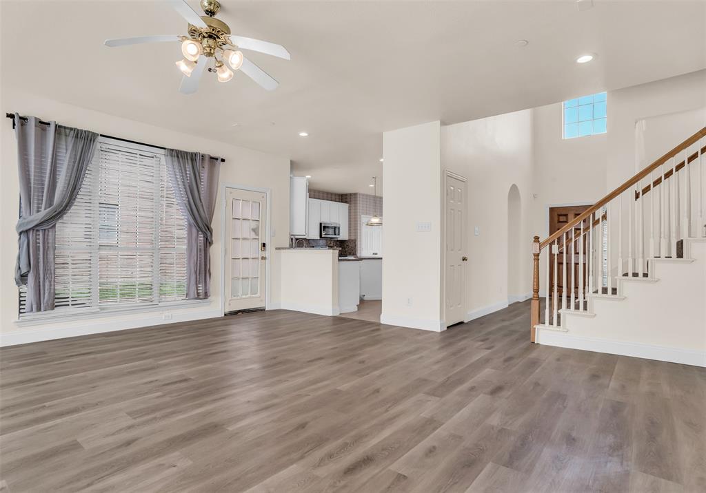 426 Richmond Street Irving, TX 75063 - Photo 10 of 33 a view of empty room with wooden floor and fan