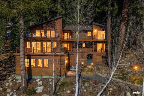 a view of a house with backyard from a balcony