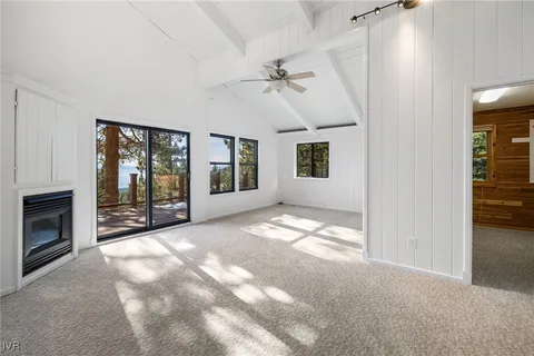 a view of a livingroom with an empty space and a fireplace