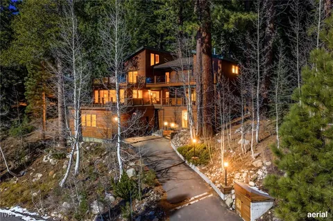 an aerial view of a house with a yard