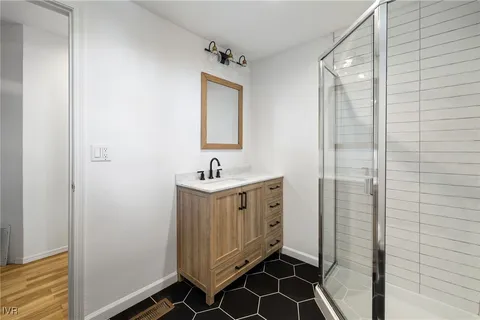 a bathroom with a sink and a mirror