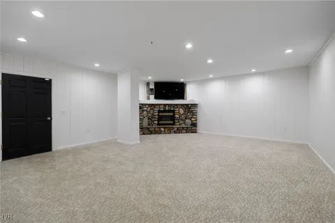 a view of empty room with a flat screen tv