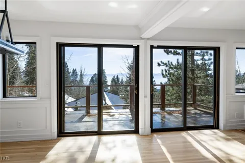 a view of a room with wooden floor and balcony