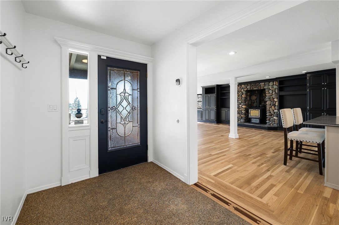 1014 Saturn Court Incline Village, NV 89451 - Photo 8 of 41 a view of a hallway to dining room with wooden floor and windows