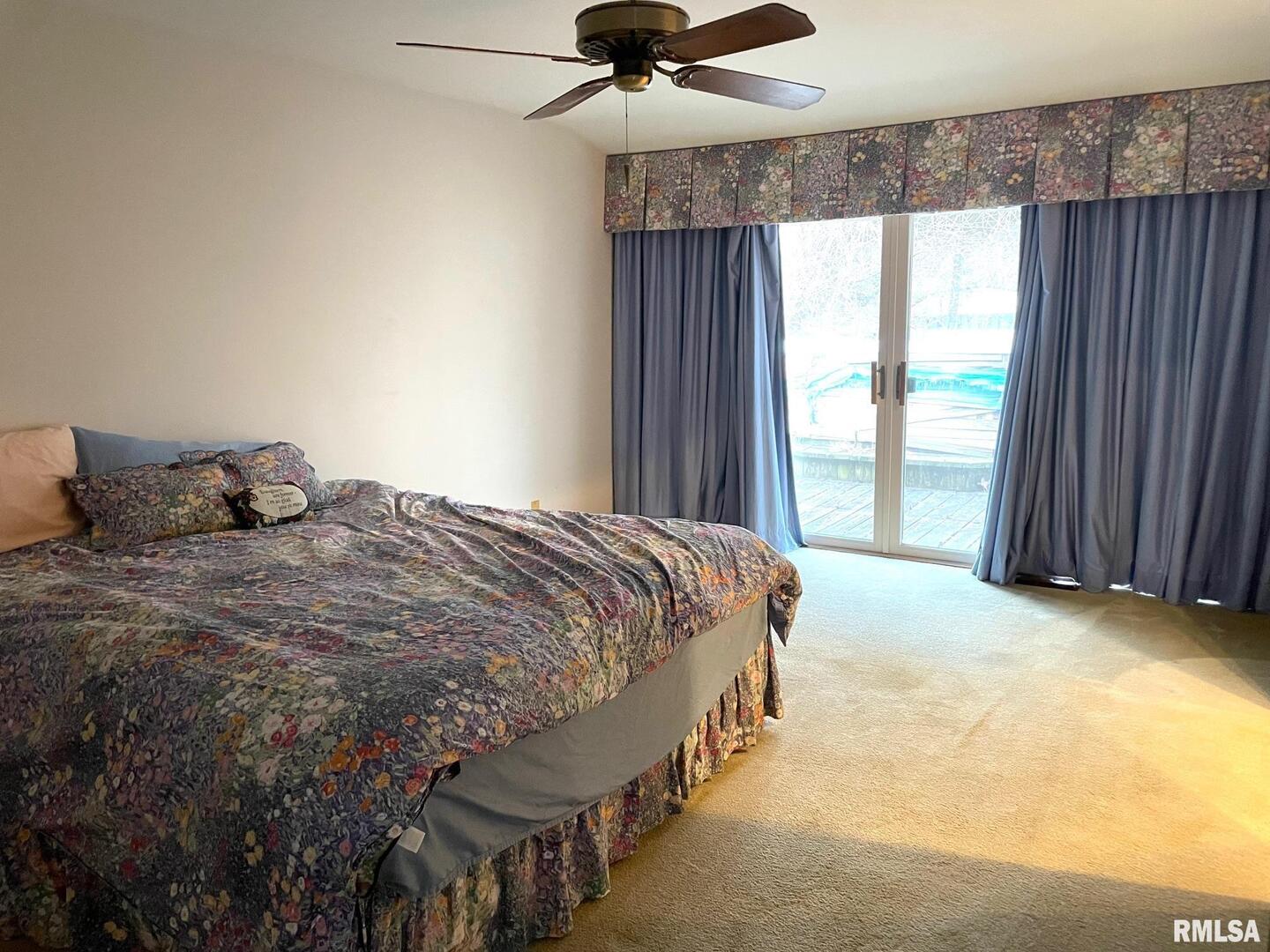 7 Pinewood Drive Carbondale, IL 62901 - Photo 12 of 20 a bed sitting in a bedroom next to a window