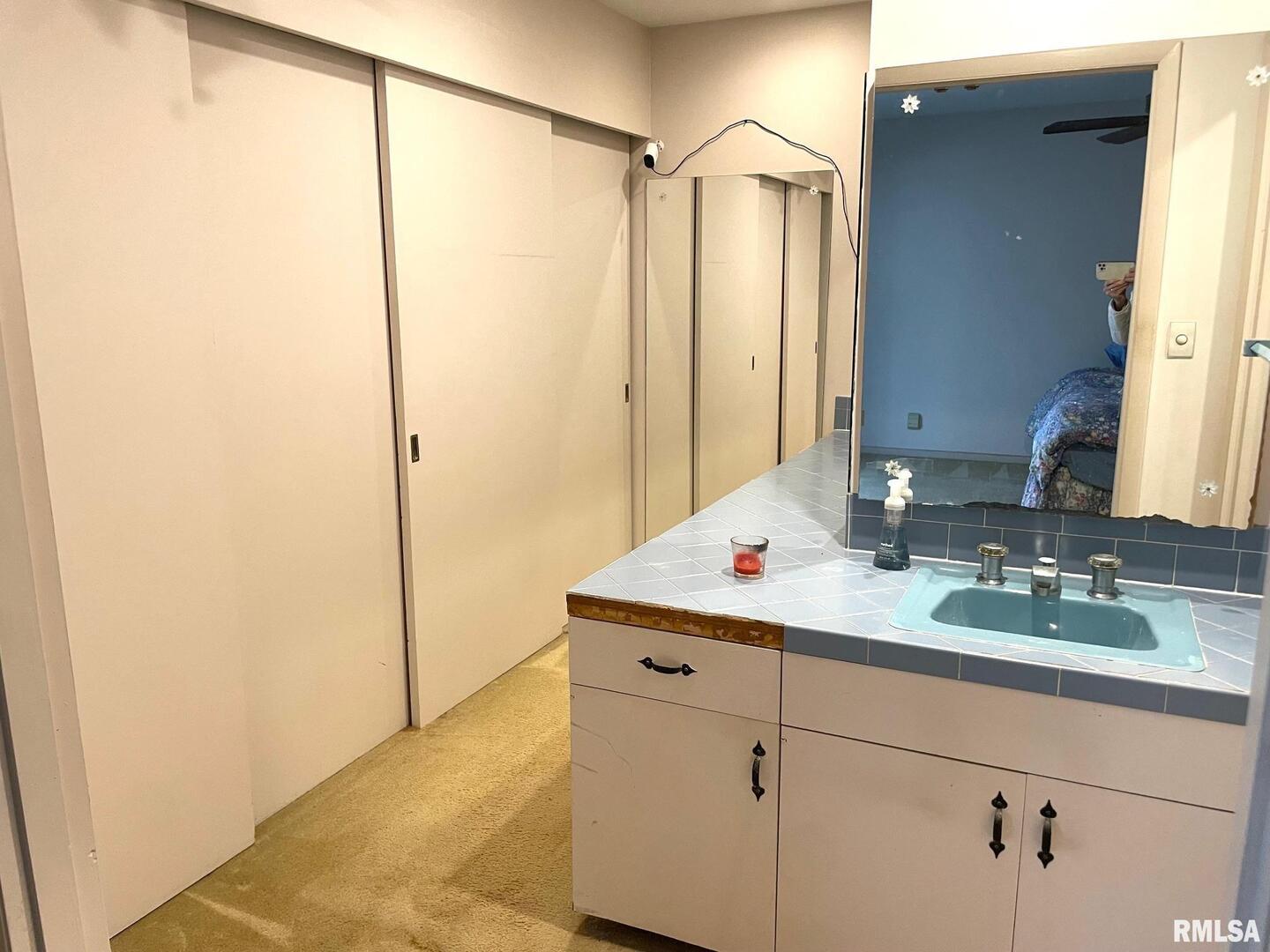 7 Pinewood Drive Carbondale, IL 62901 - Photo 13 of 20 a bathroom with a granite countertop sink and a mirror