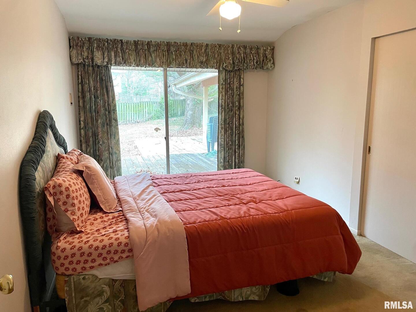 7 Pinewood Drive Carbondale, IL 62901 - Photo 15 of 20 a bed sitting in a bedroom next to a window