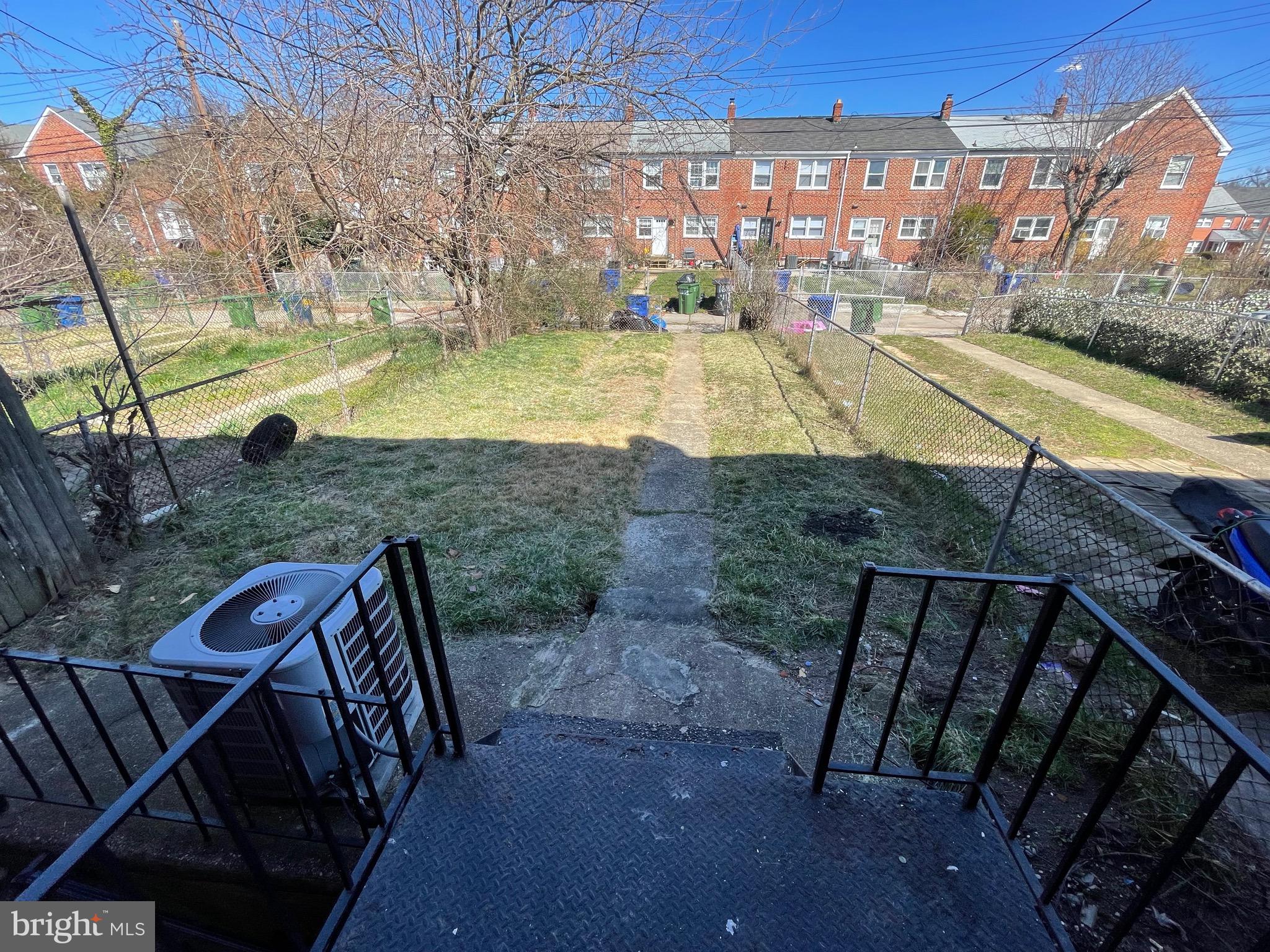 1640 Ingram Road Baltimore, MD 21239 - Photo 3 of 26 a view of a swimming pool with a patio and a yard
