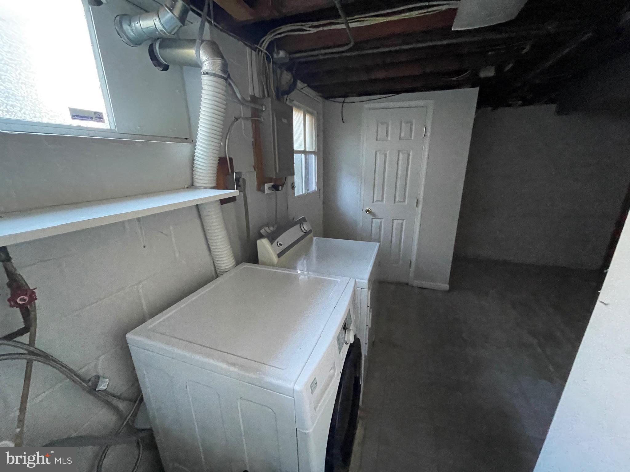 1640 Ingram Road Baltimore, MD 21239 - Photo 6 of 26 a utility room with dryer and washer