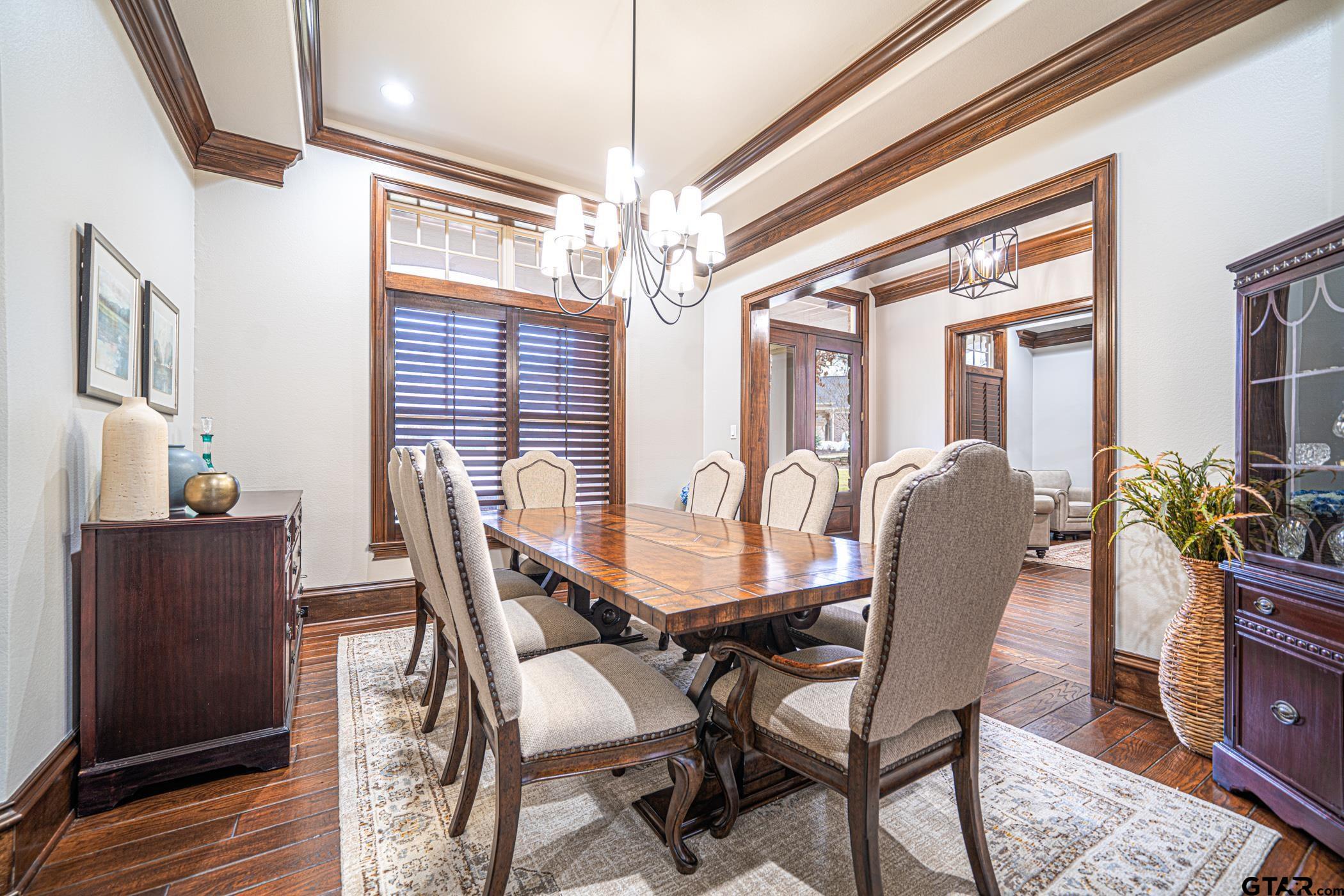 3841 Castle Ridge Drive Longview, TX 75605 - Photo 4 of 42 a view of a dining room with furniture and chandelier