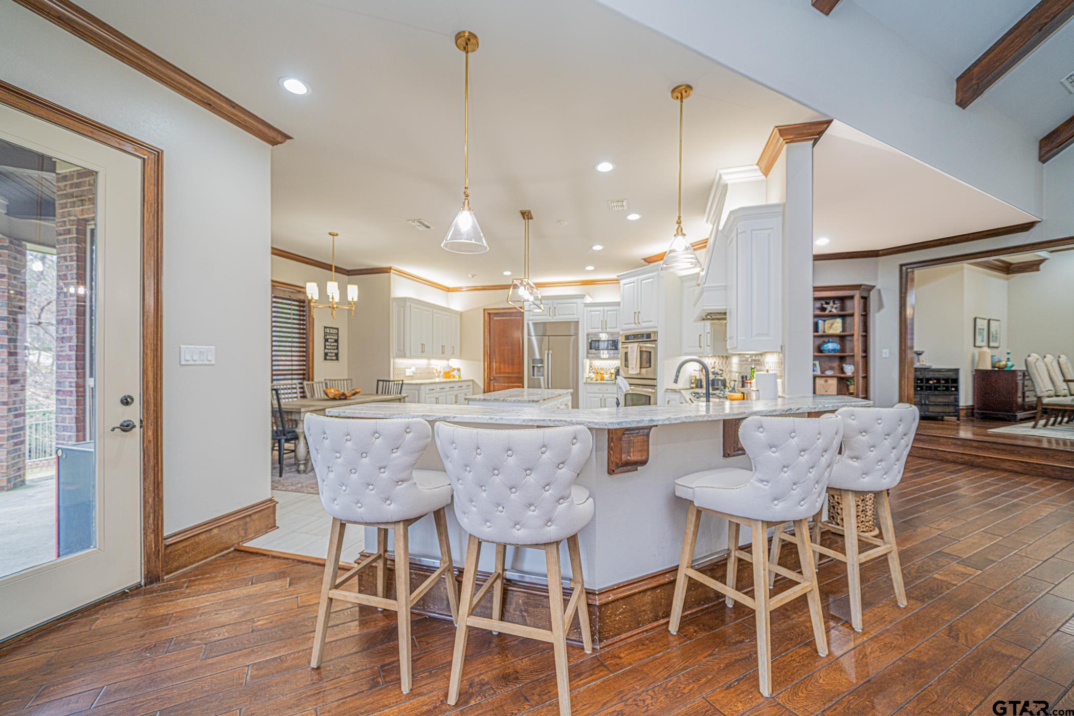 3841 Castle Ridge Drive Longview, TX 75605 - Photo 5 of 42 a dining room with furniture and wooden floor