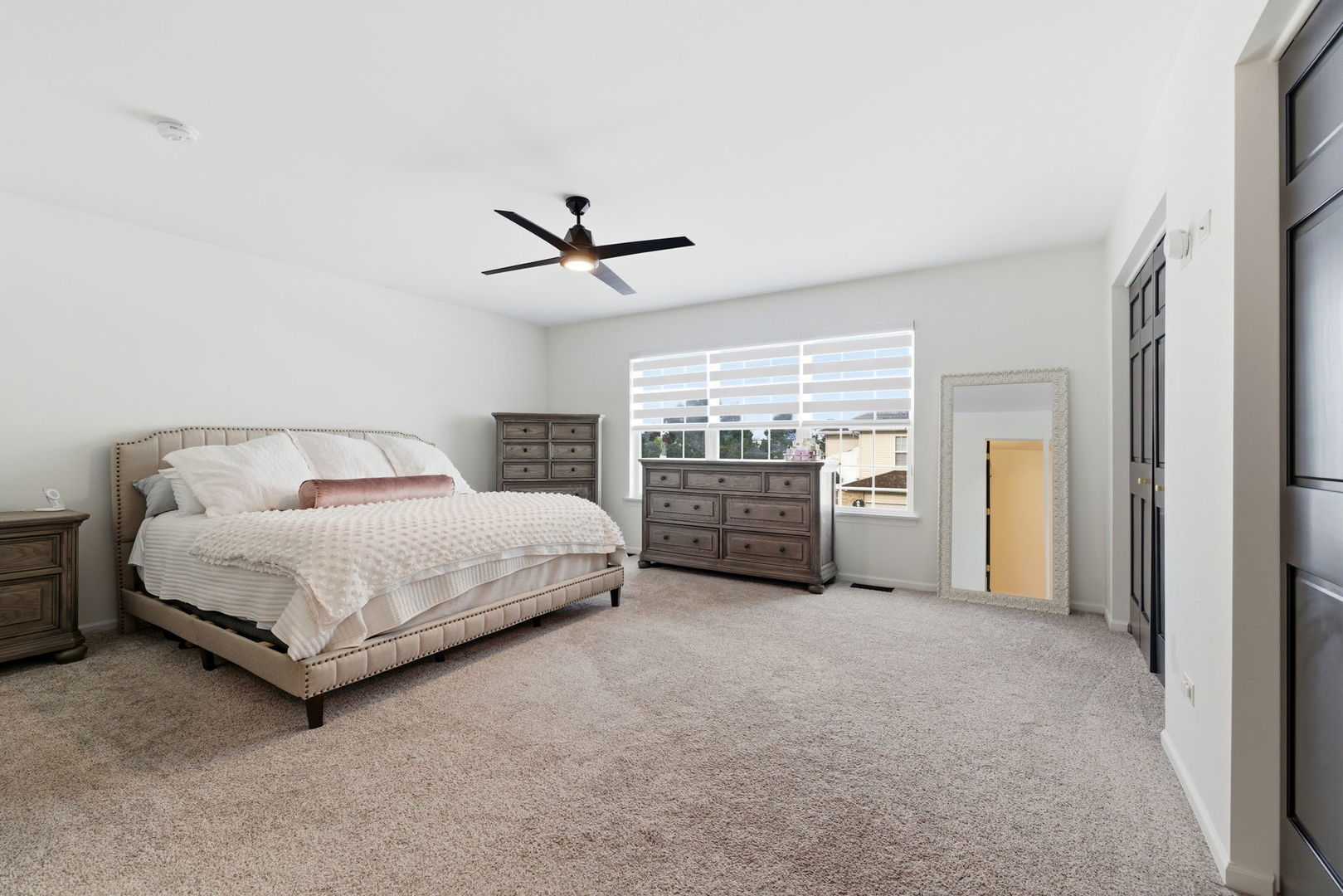 19320 Tramore Lane Mokena, IL 60448 - Photo 13 of 28 a spacious bedroom with a bed and a chandelier
