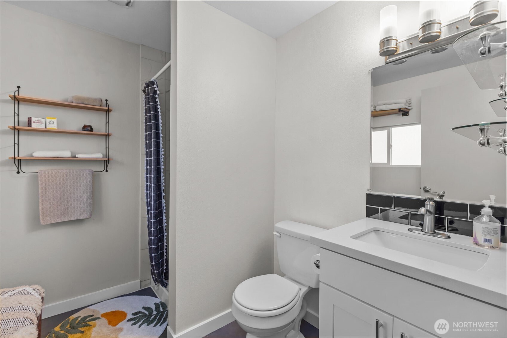 215 Hubbard Road Lynnwood, WA 98036 - Photo 16 of 40 a bathroom with a sink toilet and vanity