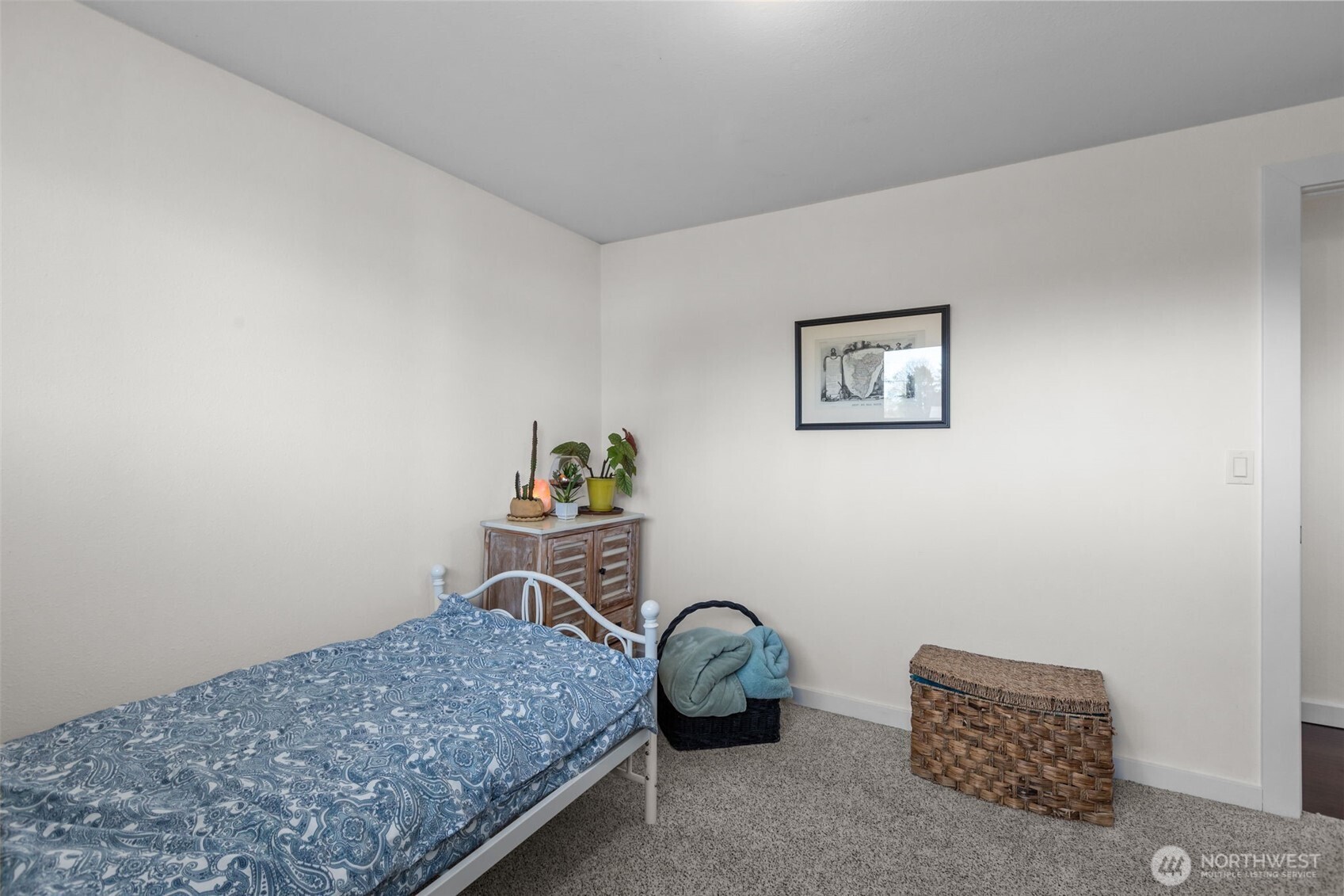 215 Hubbard Road Lynnwood, WA 98036 - Photo 18 of 40 a bedroom with a bed and painting on the wall