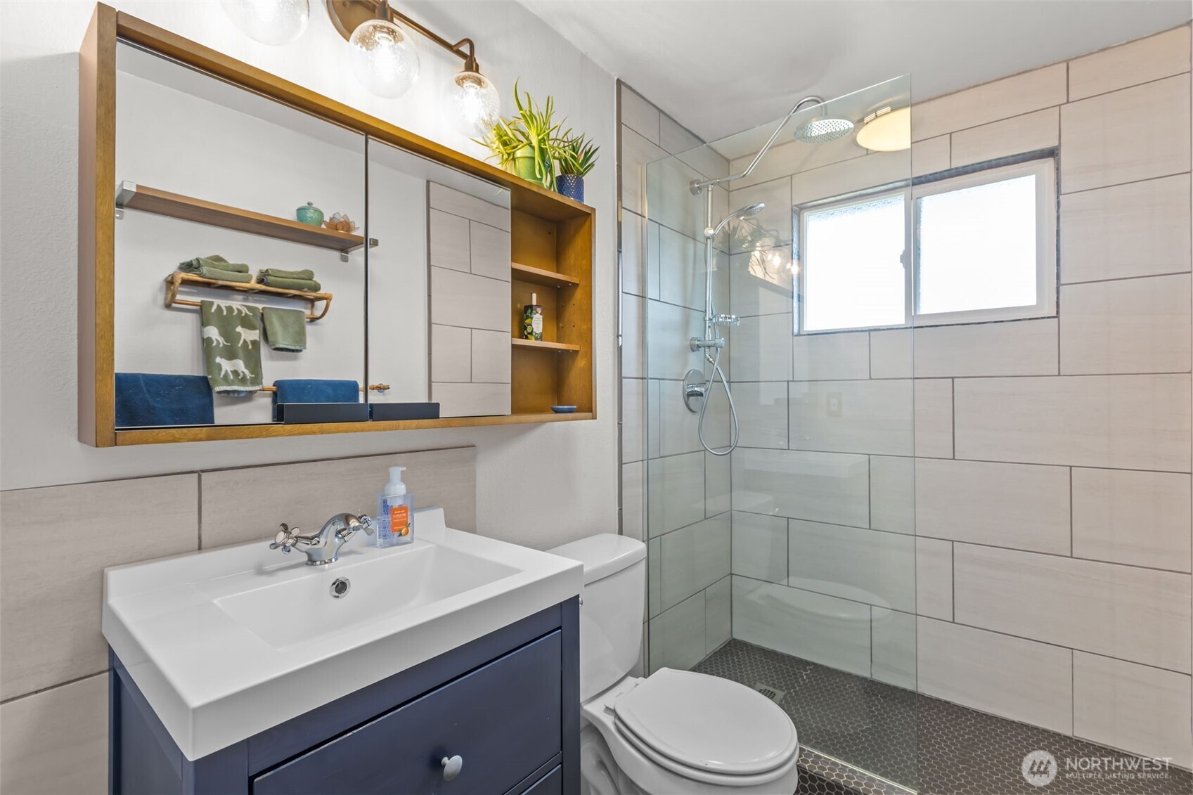215 Hubbard Road Lynnwood, WA 98036 - Photo 19 of 40 a bathroom with a sink mirror toilet and shower