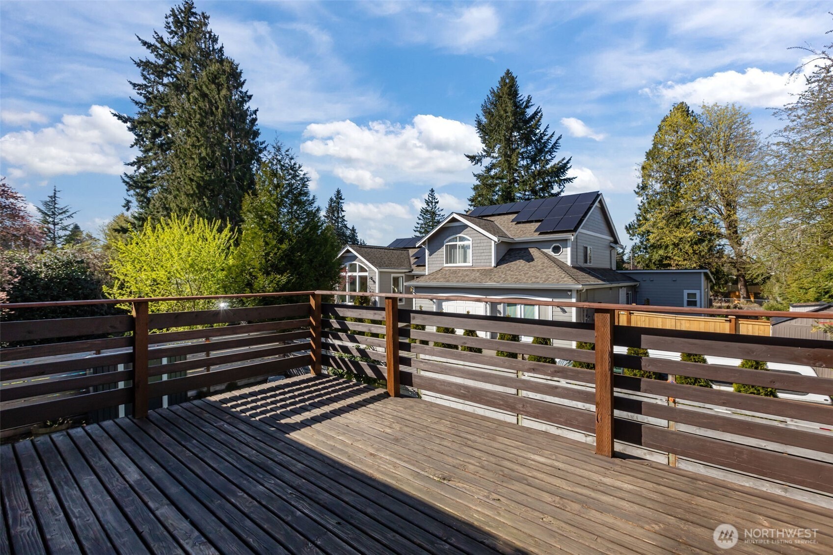 215 Hubbard Road Lynnwood, WA 98036 - Photo 38 of 40 a view of street with wooden stairs and a bench