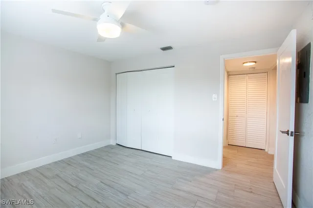 a bathroom with a sink a toilet and shower a mirror